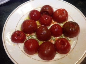 Halved tomatoes with olive oil