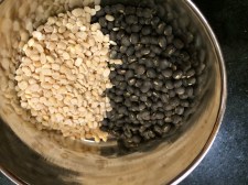 Vigna mungo, black gram, urad dal: whole on the left, split and dehusked on the right.